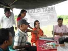 PFI officials Satyavrat Vyas(sitting extreme right) and Chandni Malik( sitting, in red outfit) at a health camp in Barpeta district.