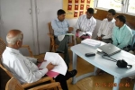 Mr Chaman Lal( back towards us) interacting with the Dibrugarh health team inside Boat Clinic Akha at Dibrugarh\'s Maijan Ghat . Seated (from left) Amrit Borah, District Communtiy Organizer,Medical officers, Dr BC Bora, Dr Ramkesh Prasad and Pharmacist Khalilur Rahman