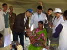 Dr. Bhobojyoti Bora, giving polio drops to a child.