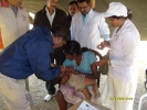 Dr. PC Hazarika administering polio drops