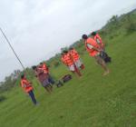 Preparing for evacuation, team hangs a life jacket on a pole for easy aerial sighting
