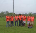 The team in life jackets,finally awaits the chopper for evacuation.
