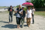 French TV journalists  Laetitia and Lise walking to a health camp at Tinsukia\'s  Laika Pomua sapori