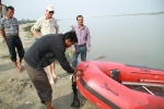 Binod Razak, Community worker, Tinsukia offering prayers before the speed boat launch as Leeman, Sanjay Sharma, Associate Programme Manager and Sasi Pamegam, Boat crew member, Jorhat looks on Binod Razak, Community worker, Tinsukia offering prayers before the speed boat launch as Leeman, Sanjay Sharma, Associate Programme Manager and Sasi Pamegam, Boat crew member, Jorhat looks on