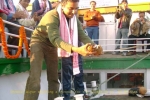 Shekhar Aiyar smashing a coconut on the occasion at SB â€œShahnazâ€