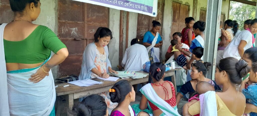 Beneficiaries gather at a Tinsukia Boat Clinic conducted camp at remote Charo and Karmi 2 island villages on 14th May 2023