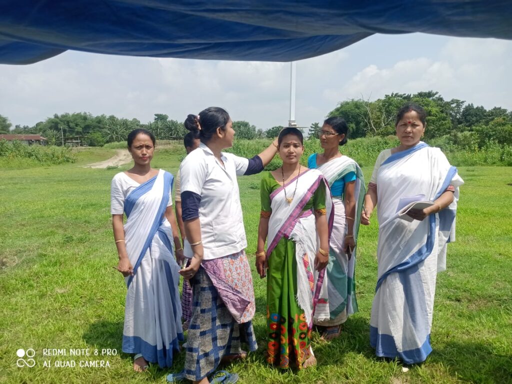 A beneficiary being given a ANC check up by the Majuli Boat team at Missamora 2 island village