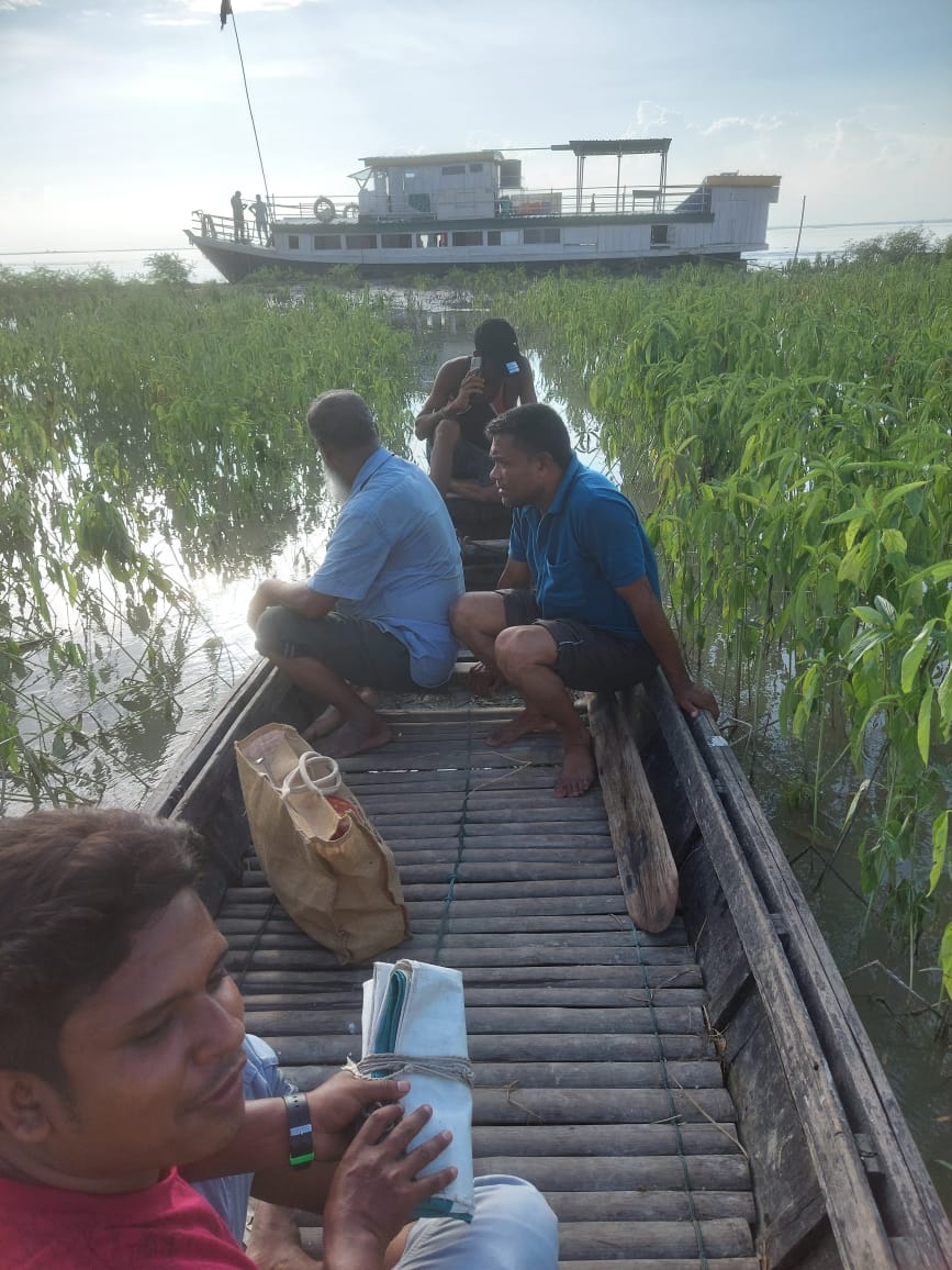 The Morigaon Boat Clinic team on way to conduct health camp through flooded villages. 13th July 2024