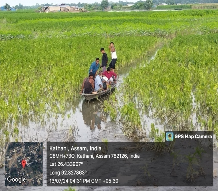 The Morigaon Boat Clinic team on way to conduct health camp through flooded villages. 13th July 2024