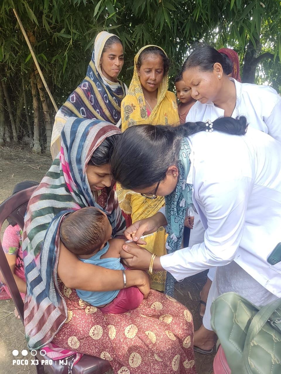 An infant being vaccinated at Tintikia Chuburi by Sonitpur Boat Clinic. 14th July 2024